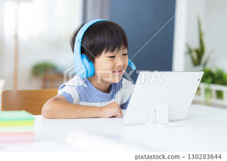 Boy studying on a tablet 130283644
