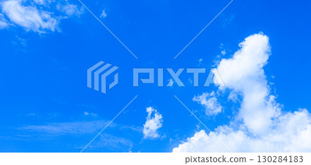 A simple landscape of blue sky and white clouds 130284183