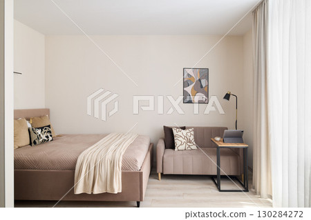 A stylish Modern Minimalist Bedroom featuring a Cozy Seating Area for relaxation and comfort A stylish Modern Minimalist Bedroom featuring a Cozy Seating Area for relaxation and comfort 130284272