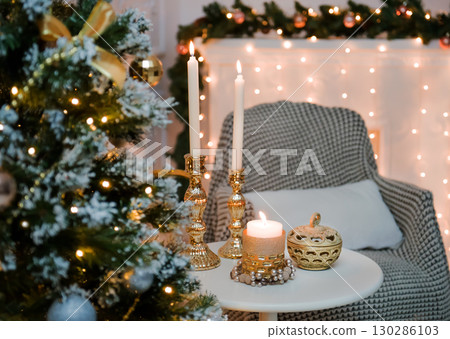 New Year's candles and a Christmas tree in the lights. 130286103