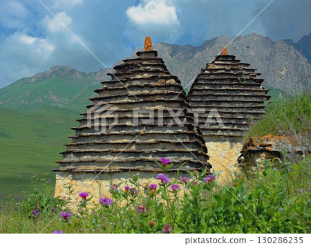 Dargavs, North Ossetia-Alania, Russia. City of the dead, ancient necropolis in the mountains of North Caucasus. Dargavs, North Ossetia-Alania, Russia. City of the dead, ancient necropolis in the mountains of North Caucasus. 130286235