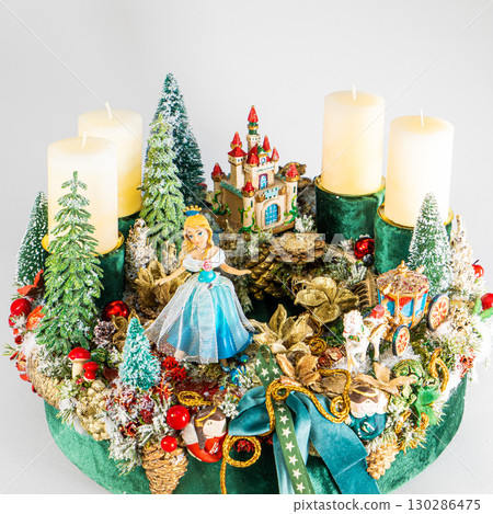 Christmas festive composition with fir branches, candles, cones and golden balls on wooden table at home. Decorated holiday concept. Decorated holiday concept. 130286475