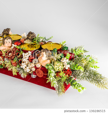 Christmas table composition. Beautiful decoration. Christmas trees, candles, stars, lights and elegant accessories. Merry Christmas and Happy Holidays, Template. 130286515