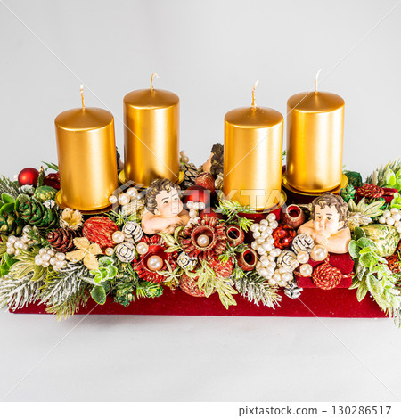 Christmas table composition. Beautiful decoration. Christmas trees, candles, stars, lights and elegant accessories. Merry Christmas and Happy Holidays, Template. 130286517