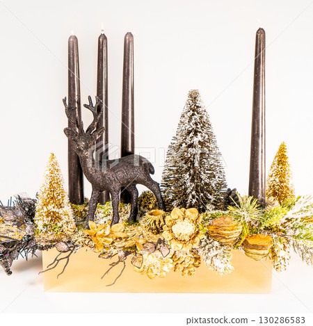 Christmas table composition. Beautiful decoration. Christmas trees, candles, stars, lights and elegant accessories. Merry Christmas and Happy Holidays, Template. Christmas table composition. Beautiful decoration. Christmas trees, candles, stars, lights and elegant accessories. Merry Christmas and Happy Holidays, Template. 130286583
