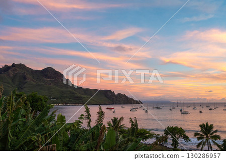 Taiohae Bay at sunset with sailboats in Nuku Hiva, Marquesas Islands, French Polynesia 130286957