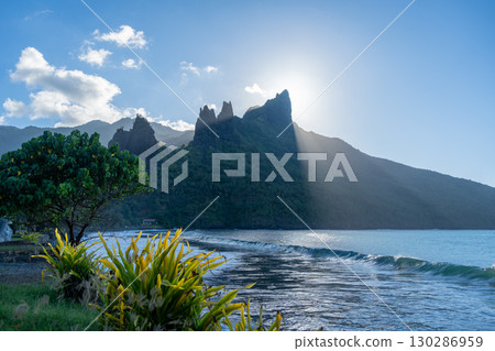 Sunset over Hatiheu Bay and beach in Nuku Hiva, French Polynesia 130286959