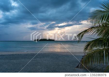 Sunset over a tropical motu on Tikehau Atoll, French Polynesia 130286978