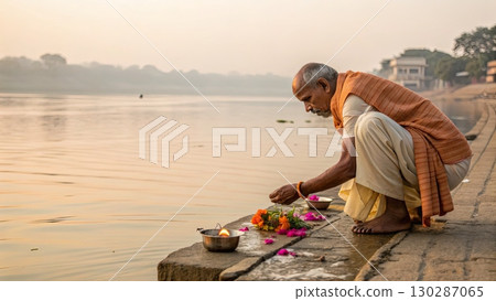 Traditional Indian Ritual by Riverside at Sunrise 130287065