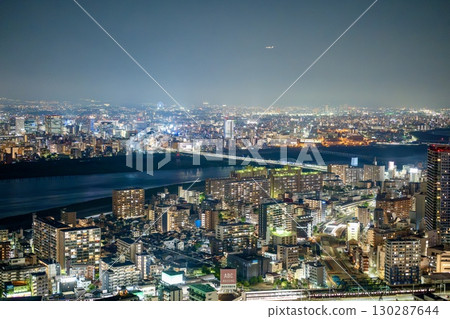 Osaka night view with a panoramic view of skyscrapers and the river Osaka night view with a panoramic view of skyscrapers and the river 130287644