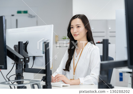 Young female engineer in office casual wear 130288202