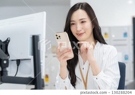 Young female engineer in office casual wear 130288204