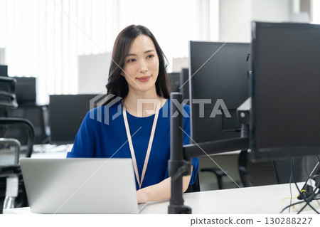 Young female engineer in office casual wear Young female engineer in office casual wear 130288227