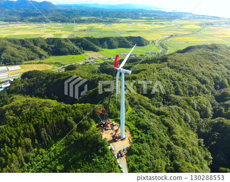 Aerial view of wind power generation wind turbine construction work in Esashi Town, Hokkaido in autumn Aerial view of wind power generation wind turbine construction work in Esashi Town, Hokkaido in autumn 130288553
