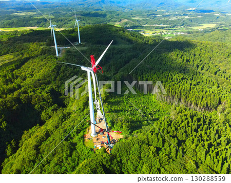 Aerial view of wind power generation wind turbine construction work in Esashi Town, Hokkaido in autumn 130288559