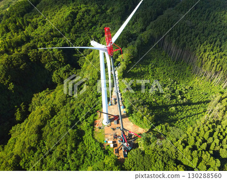 Aerial view of wind power generation wind turbine construction work in Esashi Town, Hokkaido in autumn 130288560