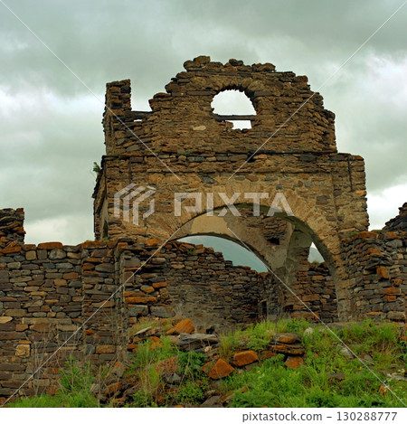 The ruined church of the Assumption of the Blessed Virgin Mary in the village of Lisri. Mamison gorge, Republic of North Ossetia. The ruined church of the Assumption of the Blessed Virgin Mary in the village of Lisri. Mamison gorge, Republic of North Ossetia. 130288777