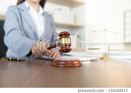 Legal Profession. Lawyer using gavel in office for justice and decision-making. 130288815