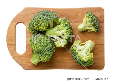 Broccoli on a kitchen board on a white background. Top view Broccoli on a kitchen board on a white background. Top view 130289138