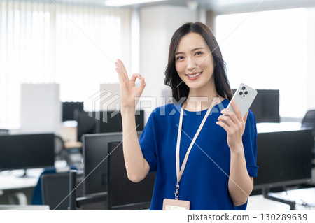 Young female engineer in office casual wear Young female engineer in office casual wear 130289639