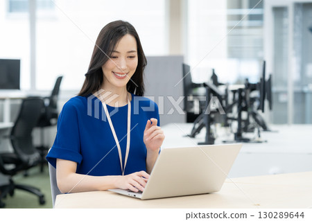 Young female engineer in office casual wear Young female engineer in office casual wear 130289644