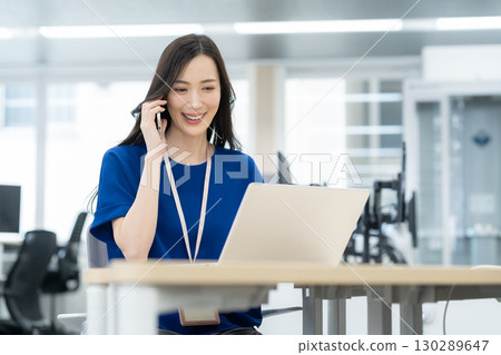 Young female engineer in office casual wear 130289647