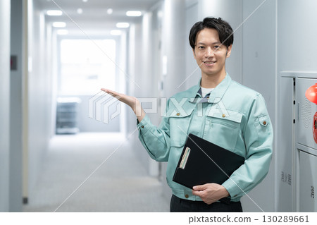 Young male engineer doing office maintenance 130289661