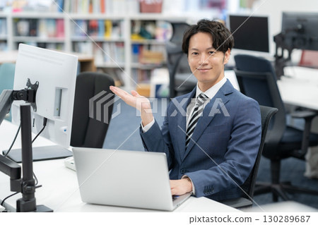 A young businessman working in the office A young businessman working in the office 130289687