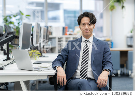 A young businessman working in the office A young businessman working in the office 130289698