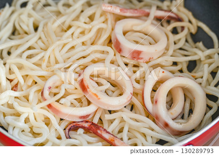 Stir-fry instant pasta noodles and squid Stir-fry instant pasta noodles and squid 130289793
