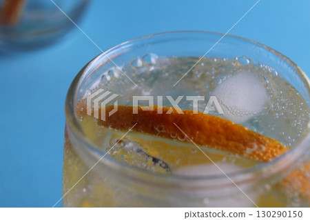 Step-by-step instruction of making lemonade. Step 3. Ready-made fresh lemonade with water ice and fruit close-up view from above on a blue background. Summer refreshing drinks. Heat remedy Step-by-step instruction of making lemonade. Step 3. Ready-made fresh lemonade with water ice and fruit close-up view from above on a blue background. Summer refreshing drinks. Heat remedy 130290150
