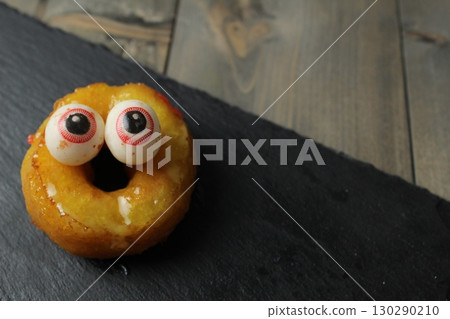 Halloween Cake. Pochik with yellow glaze and eyes. Halloween Treats Halloween Cake. Pochik with yellow glaze and eyes. Halloween Treats 130290210