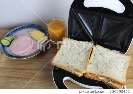 cooking a sandwich in a sandwich. Avtrak snack cooking a sandwich in a sandwich. Avtrak snack 130290461