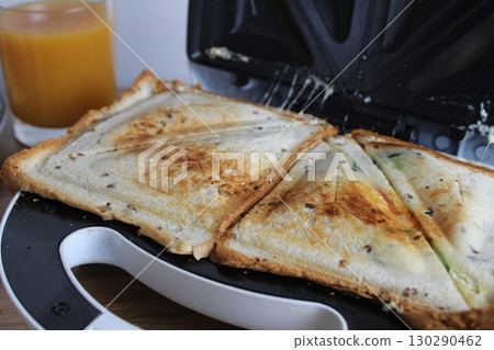 cooking a sandwich in a sandwich. Avtrak snack cooking a sandwich in a sandwich. Avtrak snack 130290462