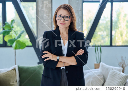 Portrait of middle-aged confident business woman looking at camera Portrait of middle-aged confident business woman looking at camera 130290948