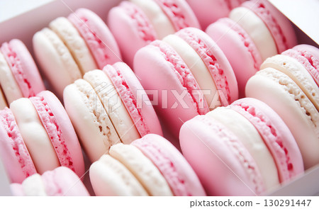 Delicious macaron dessert with pink and white pastry, a sweet gourmet treat 130291447