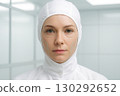 Female Scientist In Cleanroom Hood With Facial Mapping Lines 130292652