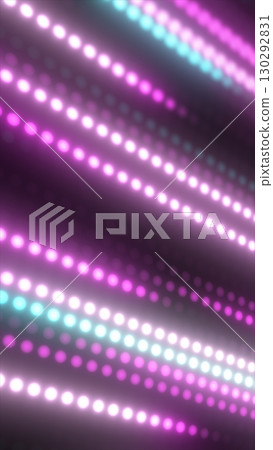 Abstract diagonal lines of glowing pink, white, and cyan dots on a dark background creating a digital light array 130292831