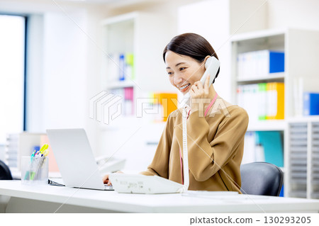 Women calling in the office Women calling in the office 130293205
