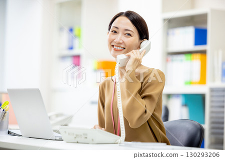 Women calling in the office Women calling in the office 130293206