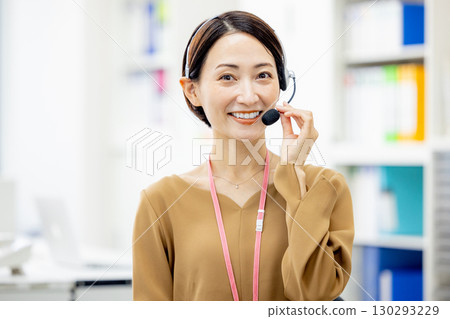 A woman working at a call center A woman working at a call center 130293229