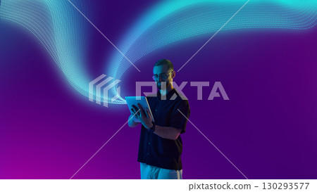 Bold colorful poster. Casual man using tablet under digital wave with bright futuristic expression 130293577