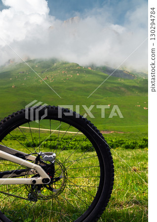 Close-up of mountain bike brake disc part. Technical expertise of bike shop service in the open air. Mountain bike parts 130294784