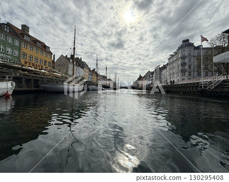 Scenic summer view of color buildings and boats of Nyhavn in Copenhagen, Denmark Scenic summer view of color buildings and boats of Nyhavn in Copenhagen, Denmark 130295408
