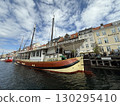 Scenic summer view of color buildings and boats of Nyhavn in Copenhagen, Denmark 130295410