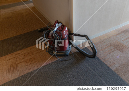 Vacuum cleaner in the hotel hallway Vacuum cleaner in the hotel hallway 130295917
