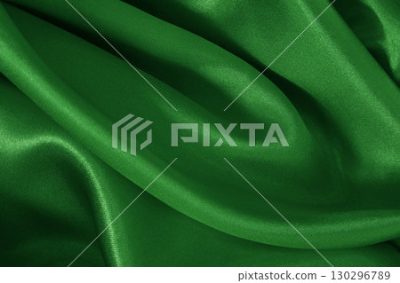 Dark green fabric cloth texture for background and design art work, beautiful crumpled pattern of silk or linen. 130296789