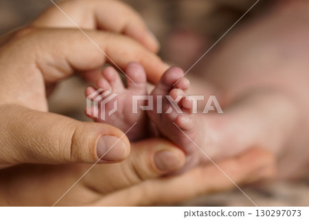 Tender Hands Holding Newborn Baby Feet, Soft Pink Skin, Close-up Portrait, Parental Love, Family Theme, Gentle Care, Warm Lighting, Realistic Style Tender Hands Holding Newborn Baby Feet, Soft Pink Skin, Close-up Portrait, Parental Love, Family Theme, Gentle Care, Warm Lighting, Realistic Style 130297073