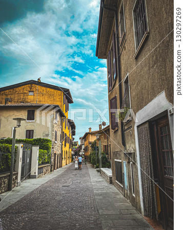 Lago di Garda Sirmione, Italy, a narrow street in the old town Lago di Garda Sirmione, Italy, a narrow street in the old town 130297269