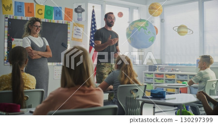 American Military Man Giving Lecture to Curious Primary School Students About Discipline and Army 130297399